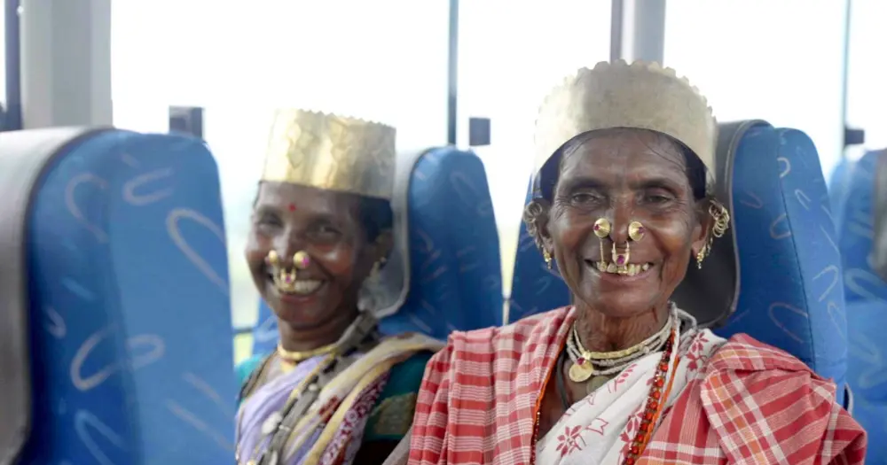 LAccMI Scheme Update: Odisha to Add 1623 Buses in Rural Areas A tribal woman inside a LAccMI Scheme Update bus